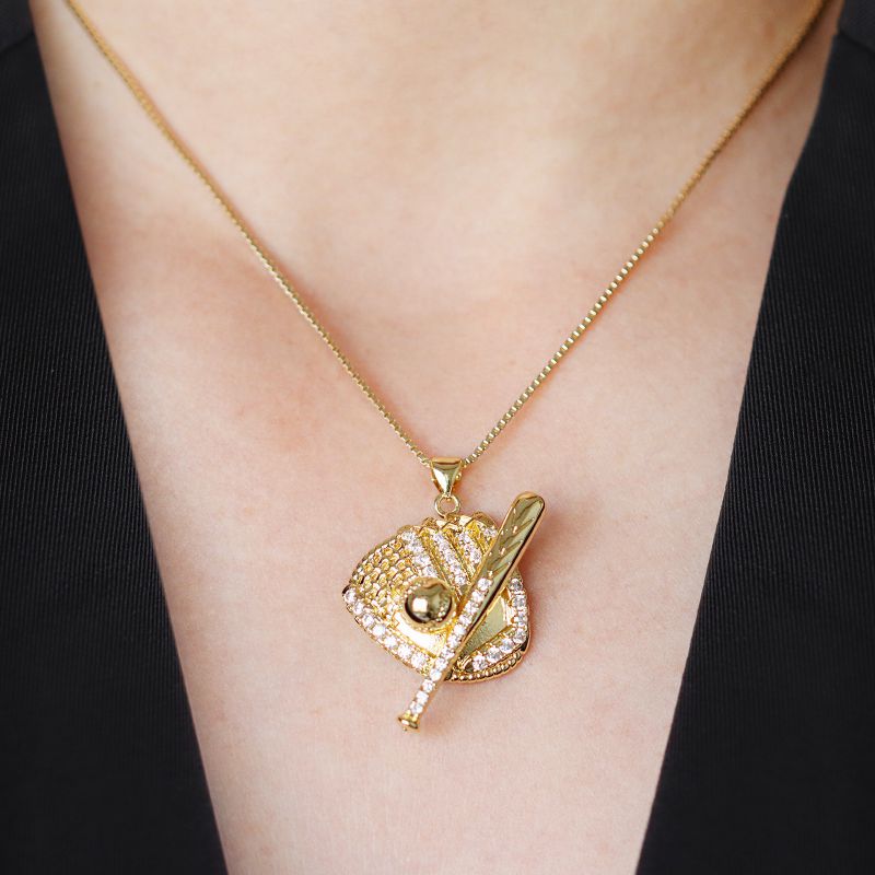 A Copper And Diamond-encrusted Baseball Boxing Glove Necklace