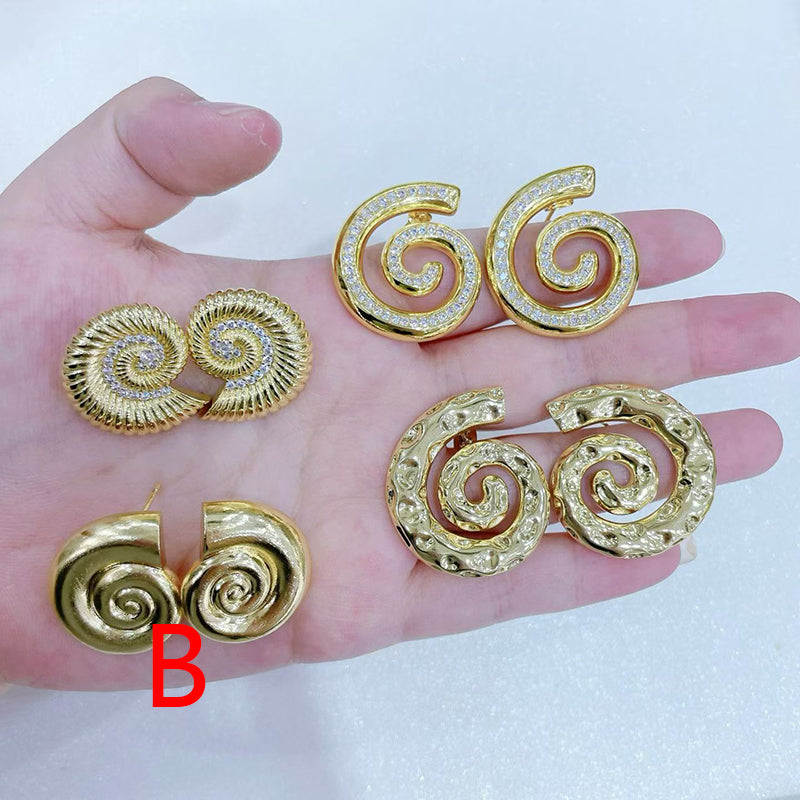 A Copper And Diamond-encrusted Conch Earrings