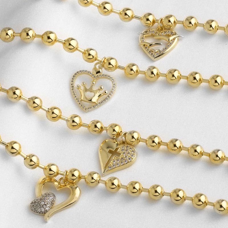 A Copper Diamond-encrusted Heart Cross Bracelet