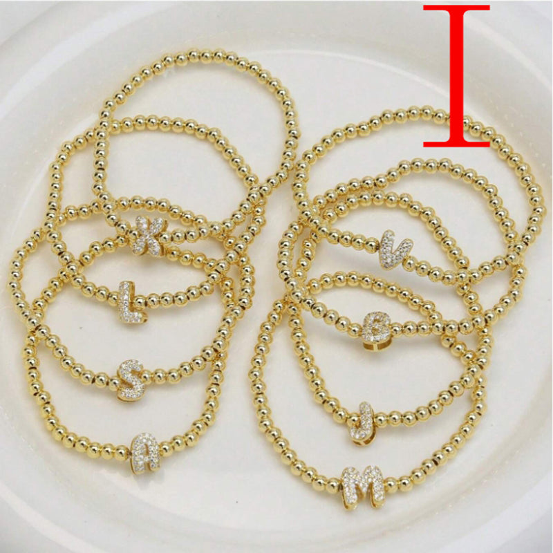 A Copper Plated Gold And Diamond Beaded 26 Letter Bracelet