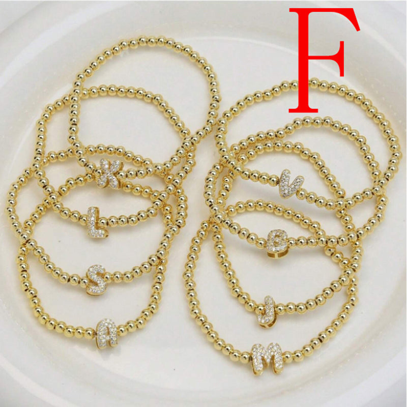 A Copper Plated Gold And Diamond Beaded 26 Letter Bracelet