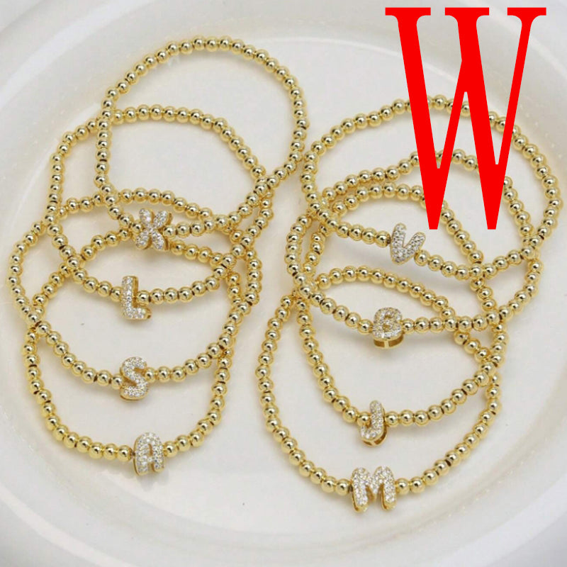 A Copper Plated Gold And Diamond Beaded 26 Letter Bracelet