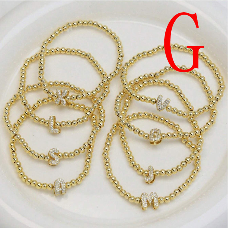 A Copper Plated Gold And Diamond Beaded 26 Letter Bracelet