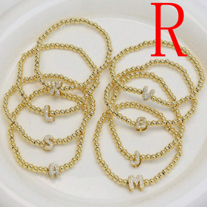 A Copper Plated Gold And Diamond Beaded 26 Letter Bracelet