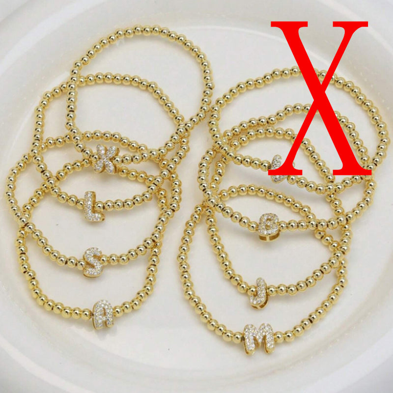 A Copper Plated Gold And Diamond Beaded 26 Letter Bracelet