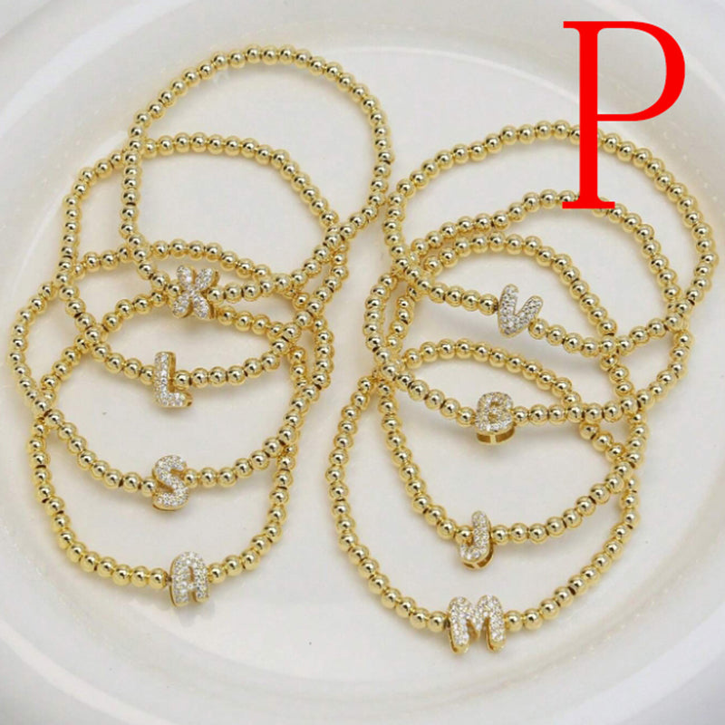 A Copper Plated Gold And Diamond Beaded 26 Letter Bracelet