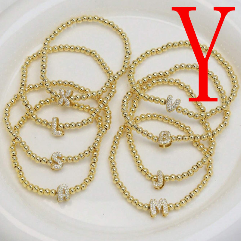 A Copper Plated Gold And Diamond Beaded 26 Letter Bracelet