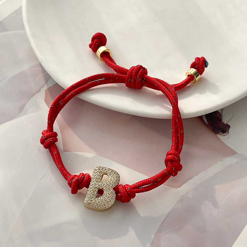 A Gold Copper-set Zircon 26-letter Alphabet Bracelet