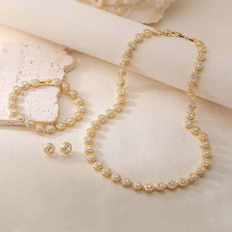 A Pair Of Gold And White Diamond Earrings Brass Round Earrings With Diamonds