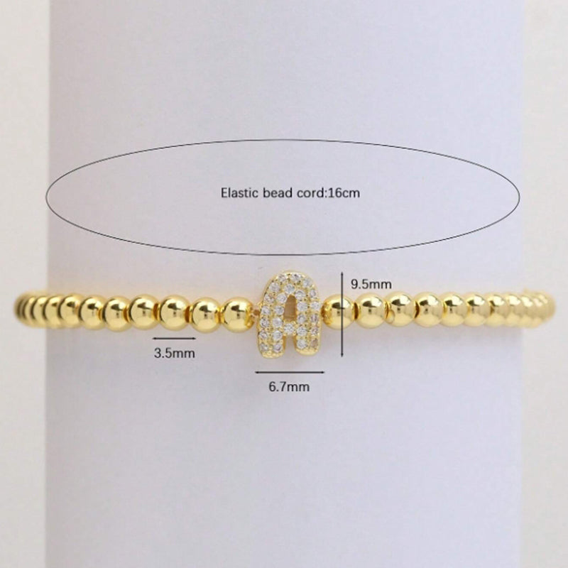 A Copper Plated Gold And Diamond Beaded 26 Letter Bracelet