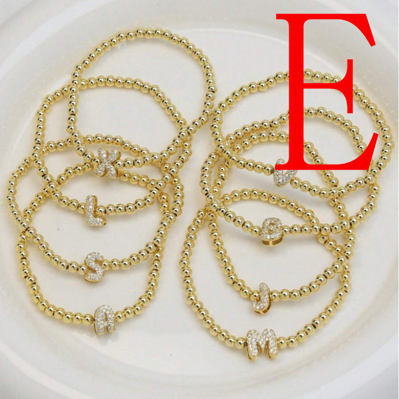 A Copper Plated Gold And Diamond Beaded 26 Letter Bracelet