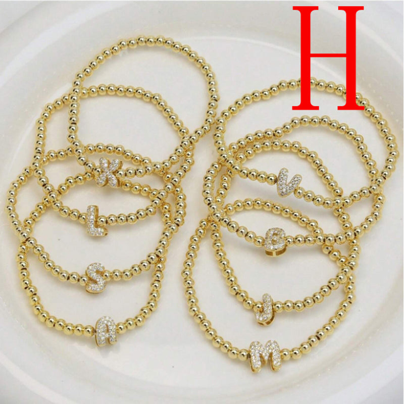 A Copper Plated Gold And Diamond Beaded 26 Letter Bracelet