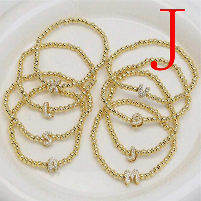 A Copper Plated Gold And Diamond Beaded 26 Letter Bracelet