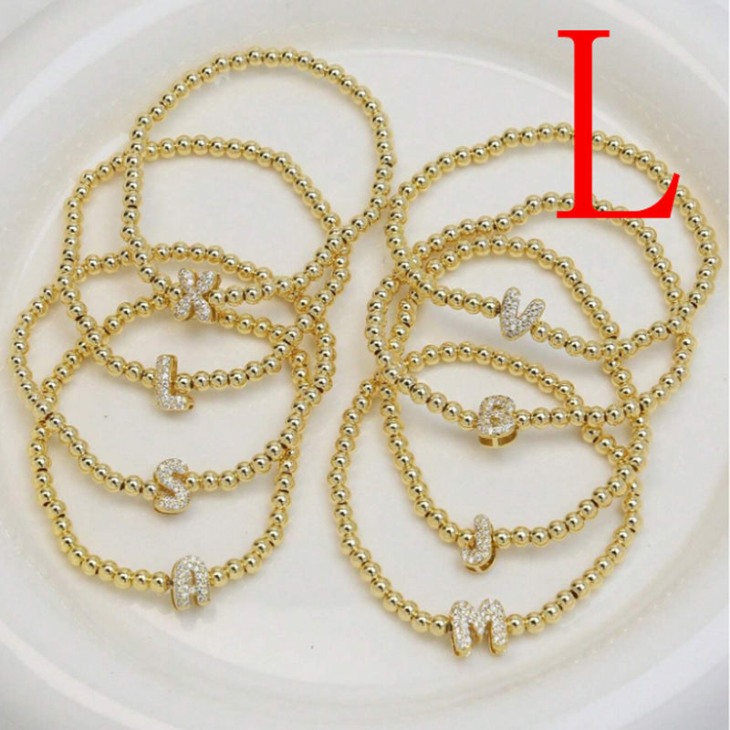 A Copper Plated Gold And Diamond Beaded 26 Letter Bracelet