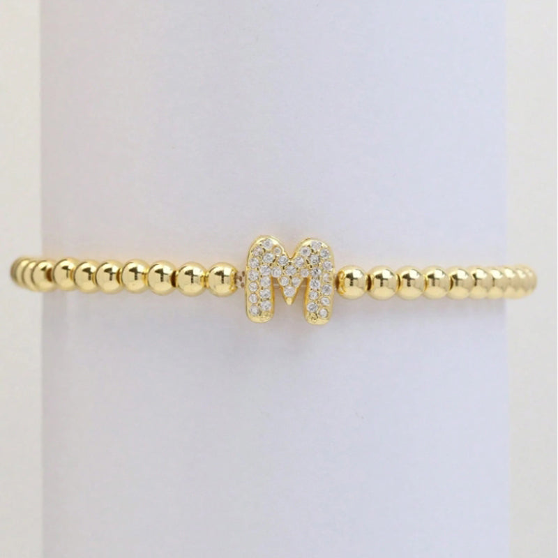 A Copper Plated Gold And Diamond Beaded 26 Letter Bracelet