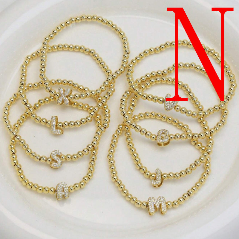 A Copper Plated Gold And Diamond Beaded 26 Letter Bracelet