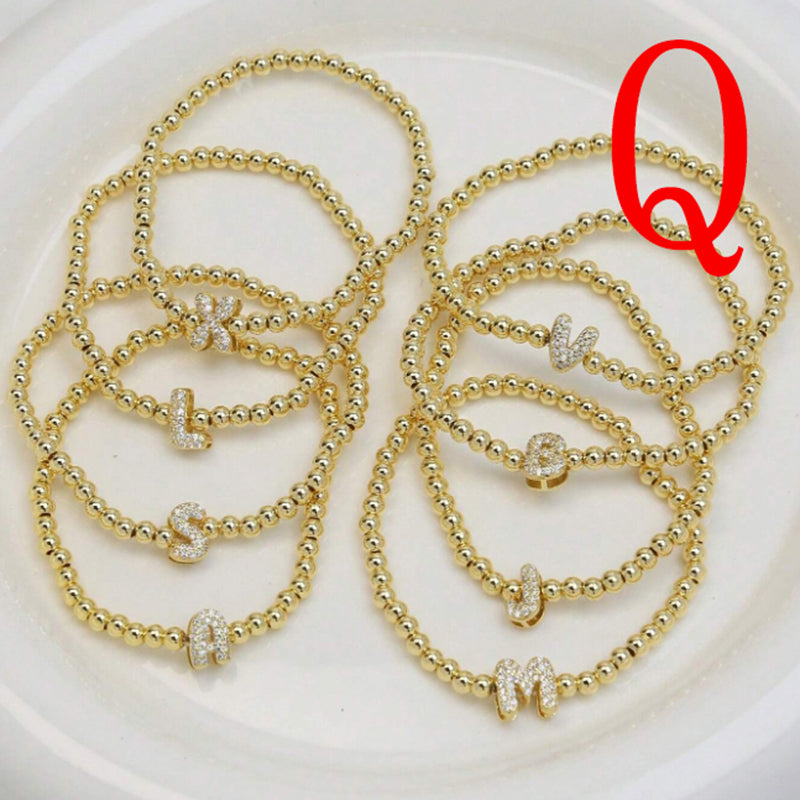 A Copper Plated Gold And Diamond Beaded 26 Letter Bracelet