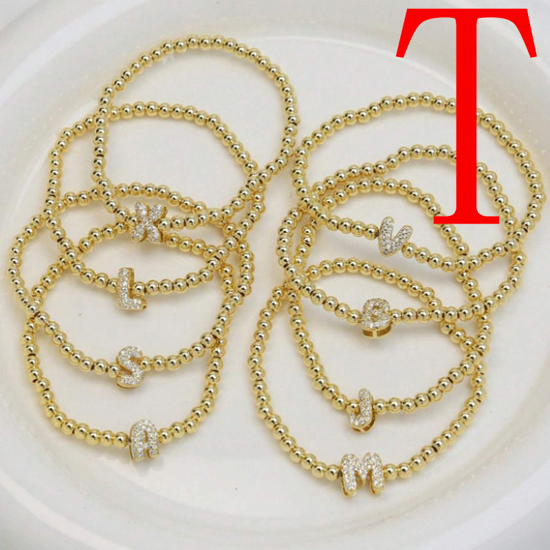 A Copper Plated Gold And Diamond Beaded 26 Letter Bracelet