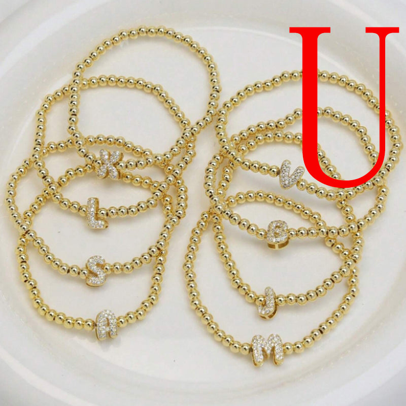 A Copper Plated Gold And Diamond Beaded 26 Letter Bracelet