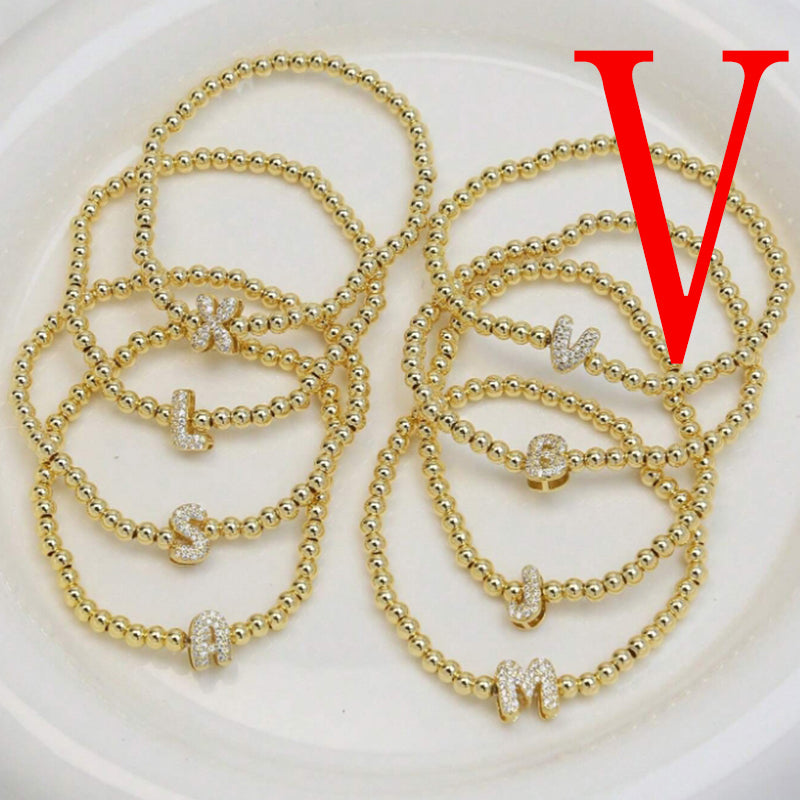 A Copper Plated Gold And Diamond Beaded 26 Letter Bracelet