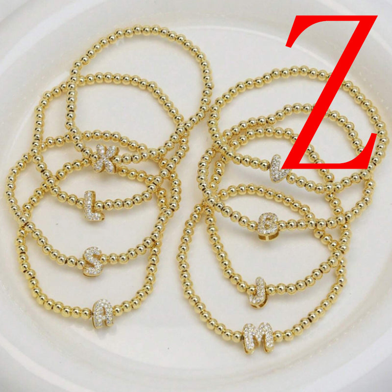 A Copper Plated Gold And Diamond Beaded 26 Letter Bracelet