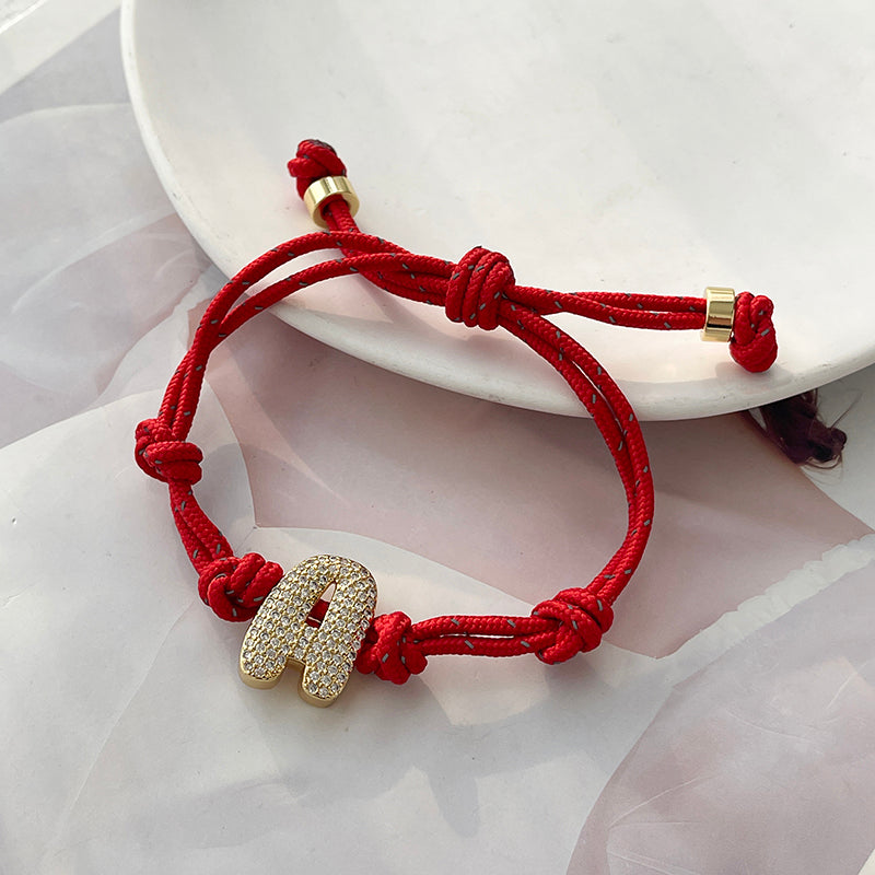 A Gold Copper-set Zircon 26-letter Alphabet Bracelet