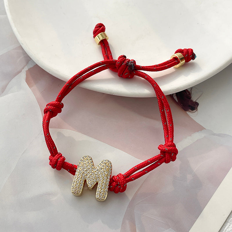 A Gold Copper-set Zircon 26-letter Alphabet Bracelet