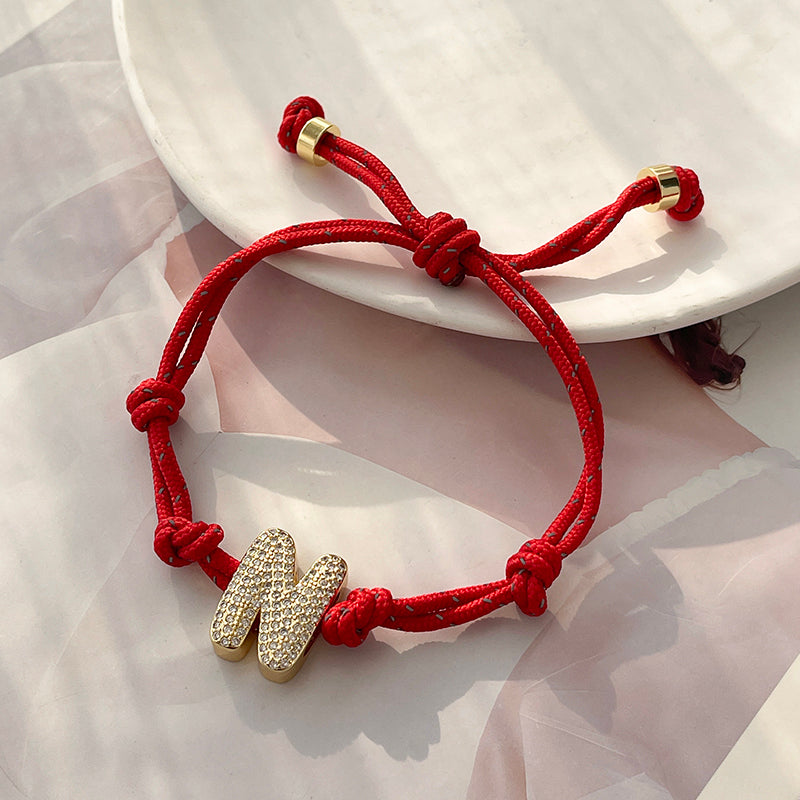 A Gold Copper-set Zircon 26-letter Alphabet Bracelet