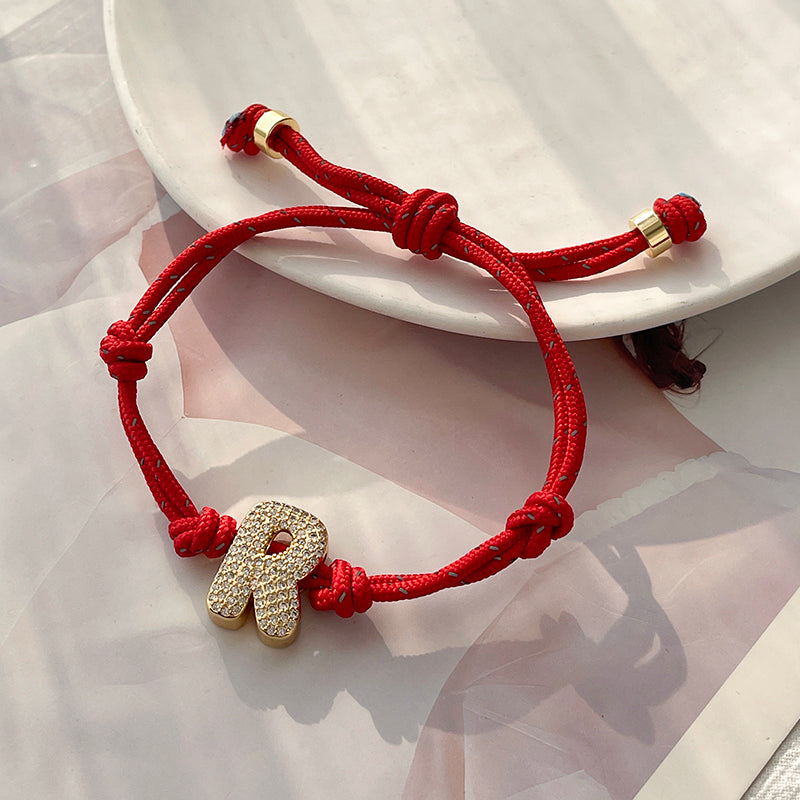 A Gold Copper-set Zircon 26-letter Alphabet Bracelet