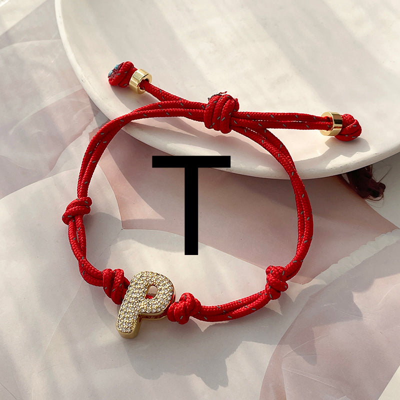 A Gold Copper-set Zircon 26-letter Alphabet Bracelet