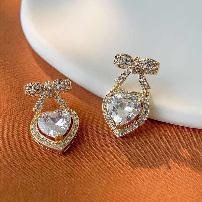Silver Copper And Diamond-encrusted Heart And Bow Earrings