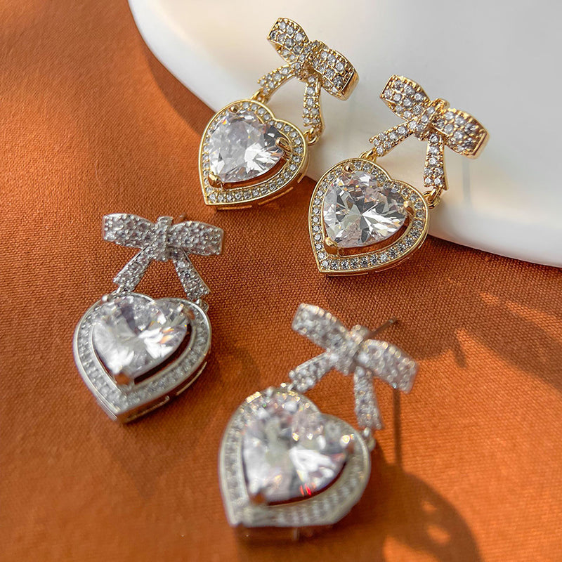 Silver Copper And Diamond-encrusted Heart And Bow Earrings
